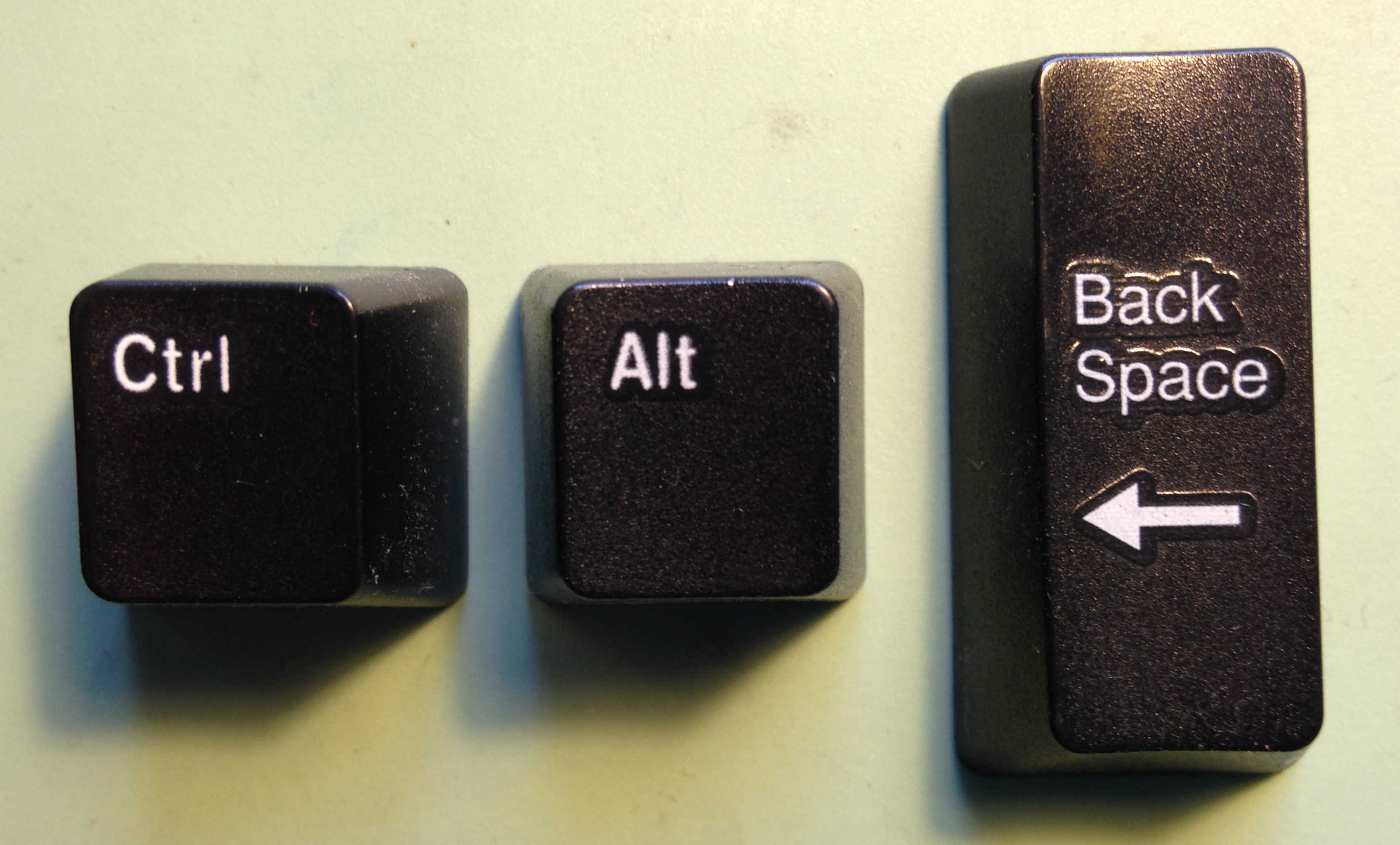Keys arranged to show Ctrl-Alt-Backspace.